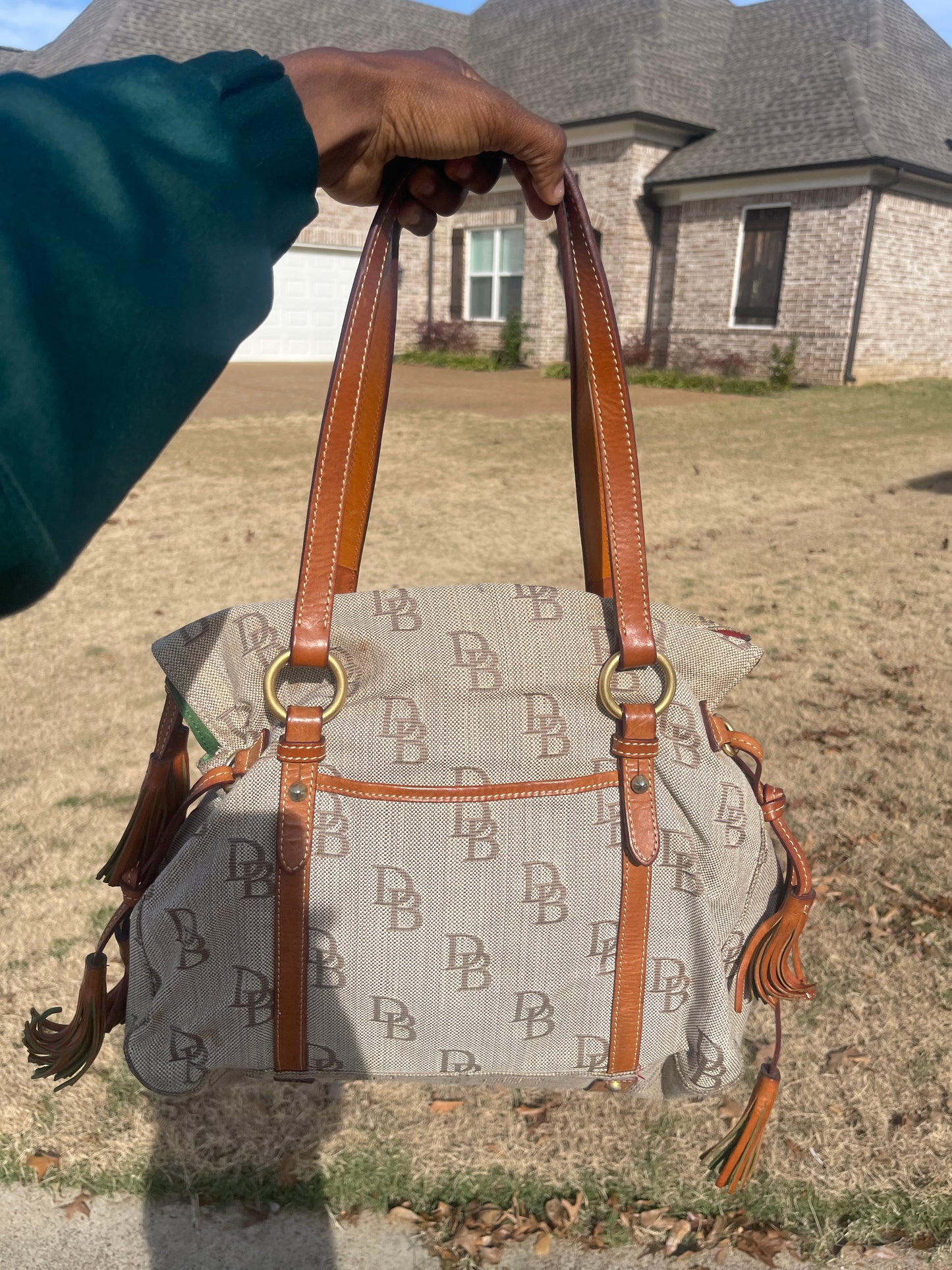 Dooney & Bourke brown handbag (need little cleaning)